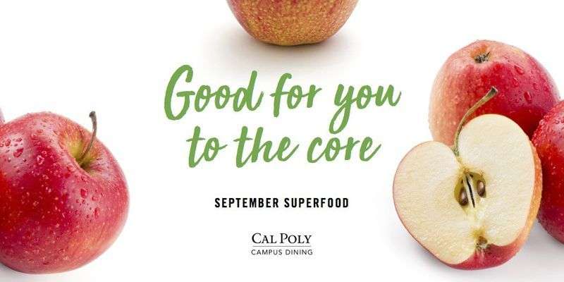 Red apples, one sliced in half, with green text "Good for you to the core" and "September Superfood" from Cal Poly Campus Dining.