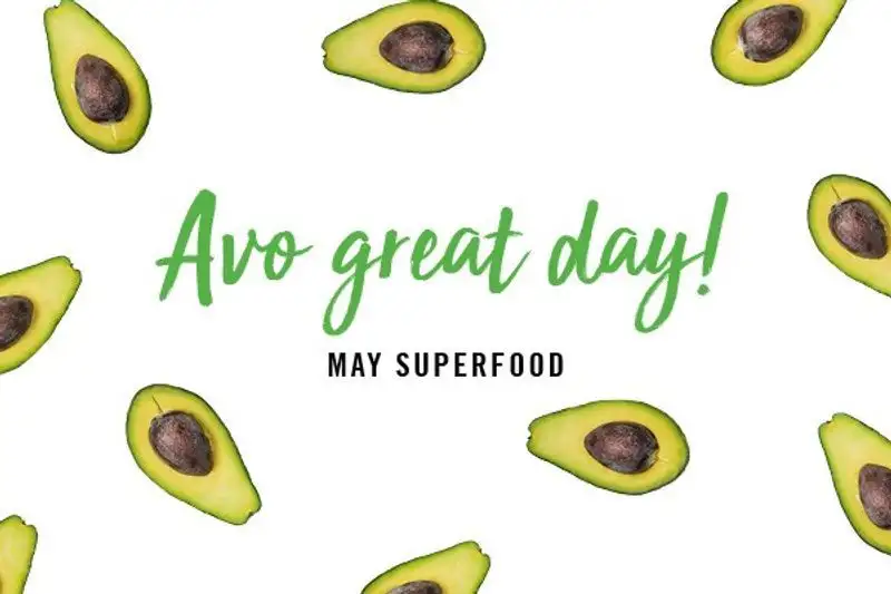 Green text "Avo great day!" and black text "May superfood" surrounded by avocado halves on white background.